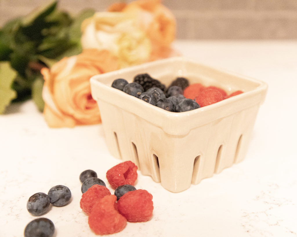 Ceramic berry basket with mixed berries