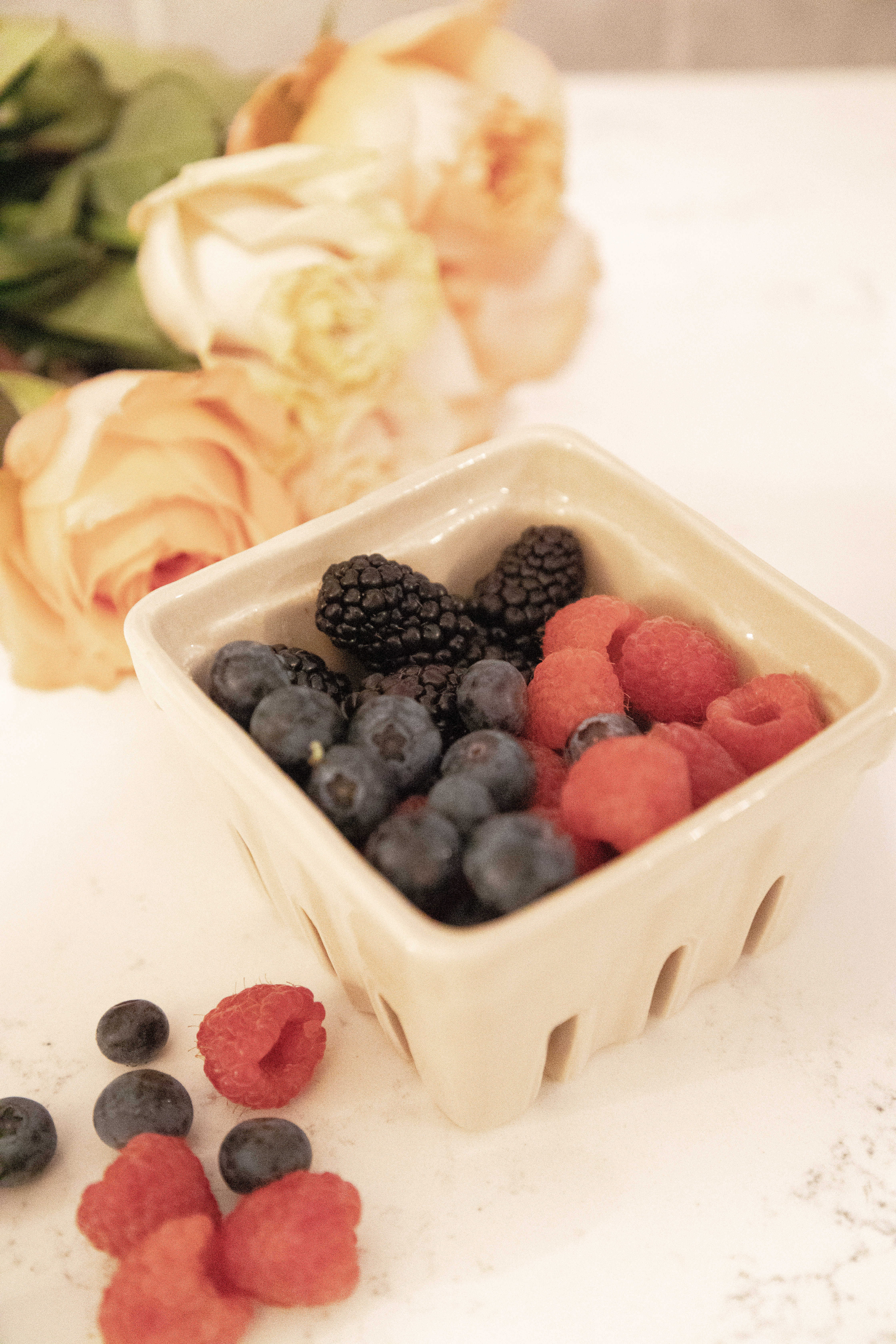 Ceramic berry basket with mixed berries